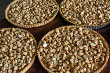 Preparing a macadamia pie with toffee. Kneading and baking of a cake. Pastry and pastry.