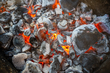 Close-up of a coals, barbecue grill with extinguished charcoal for barbecue or shish kebab