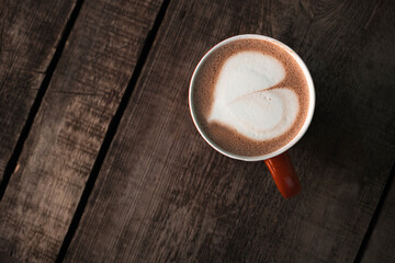 Cup of hot chocolate on a wooden surface
