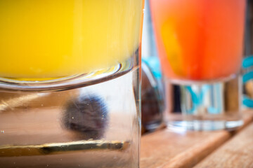 Gjirokaster, Albania Exotic drinks on a wooden bar table outdoors.