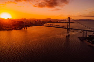 Fototapeta na wymiar Aerial view of Hercilio luz cable bridge with sunset in Florianopolis, Brazil