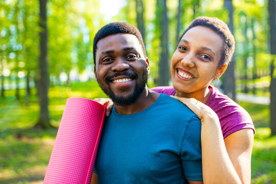 Latin American Couple Ready To Yoga Time Outdoors Pink And Blue Look