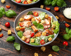 Salmon Caesar salad with grilled fish, croutons and cherry tomatoes