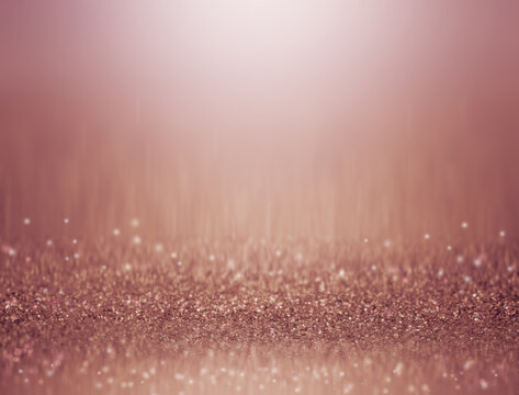 abstract rose gold background with shiny backdrop texture. 