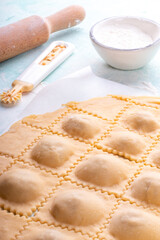 Making homemade ravioli, italian cuisine, uncooked pasta.