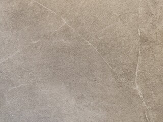 Perfect background shot for designers of a beautiful unique beige brown wall with light colored cracks