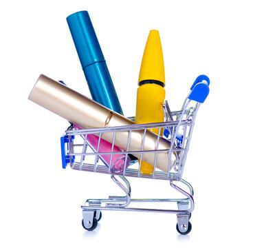 Cosmetics in grocery cart makeup on white background isolation