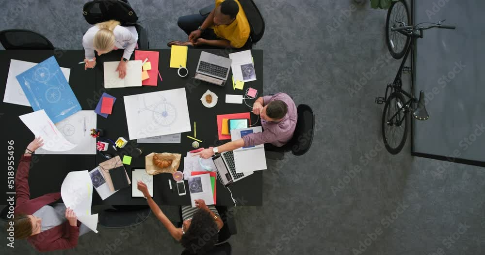 Aufkleber group of diverse colleagues using technology while sitting in a corporate workplace from above. info