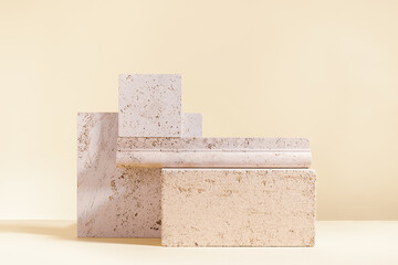 Abstract modern still life. Natural materials. Composition of travertine and concrete blocks.