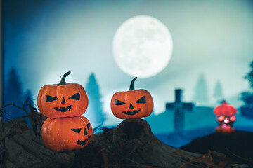 Spooky cemetery with glow halloween pumpkin