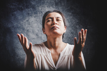 Woman Pray for god blessing to wishing have a better life