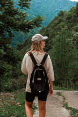 Travel. Girl travels through the mountains and waterfalls of wild nature. Unity, mental health, eco travel. Hiking in the mountains, van life vibes, travelling,good moments, digital detox
