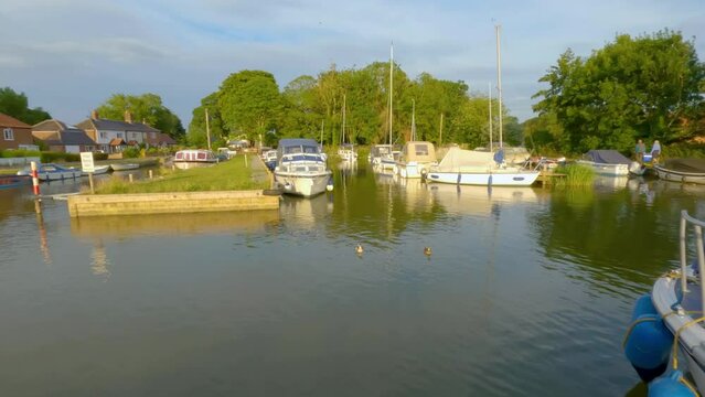 Panorama of a dyke and boatyard in the heart of the Norfolk Broads. Captured late evening as the sun is starting to get low in the sky