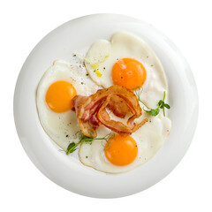 Fried eggs with bacon on white plate isolated on white background top view