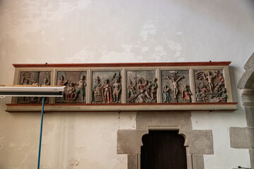 Ploumilliau (Plouilio), France. Polychrome panels of the old rood screen inside the Eglise Saint-Milliau (St Miliau Church)
