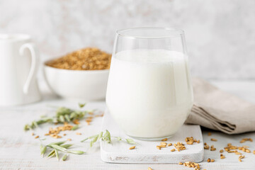 Oat milk. Healthy vegan non dairy alternative oat milk drink in a glass