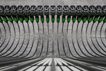 A 3D representation of the row of electric vehicle battery connection plugs on the concrete backdrop.