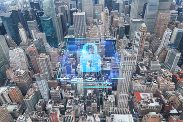 Fototapeta na wymiar Aerial panoramic roof top city view of New York City Financial Downtown district at day time. Manhattan, NYC, USA. The concept of cyber security to protect confidential information, padlock hologram