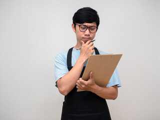 Young businessman looking at check list board thinking about work