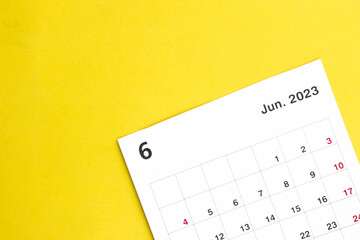 june calendar 2023 on a yellow background.