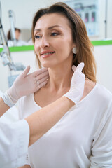 Dermatologist examines the skin of the patient face