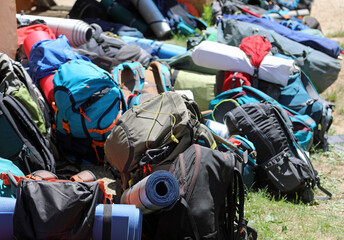 pile of backpacks used by young travelers during traveling camping around the world