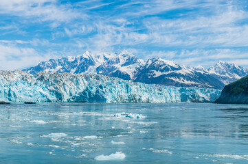 Fototapeta na wymiar A view in Disenchartment Bay towards in the snout of the Hubbard Glacier and Russell Fjord, Alaska in summertime