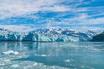 A view past icebergs in Disenchartment Bay towards in the Hubbard Glacier and Russell Fjord, Alaska in summertime
