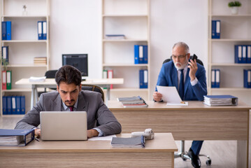 Two male colleagues working in the office