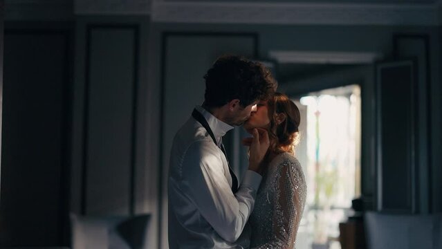 Wonderful Young Couple. Bride And Groom. Girl In Long White Dress And Curly Man In White Shirt. Romantic Kiss.
