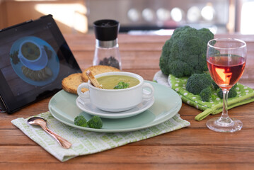 Broccoli cream soup with croutons  for an healthy eating without calories. Wooden table as background
