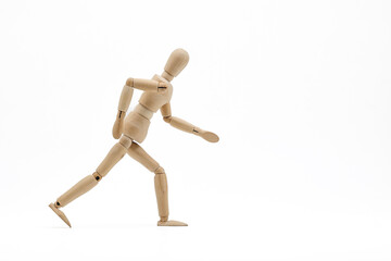 Wooden mannequin on white background. Running  concept.