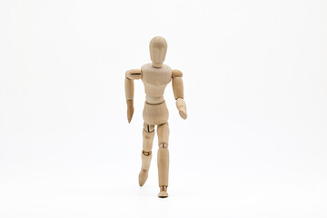 Wooden mannequin on white background. Running  concept.