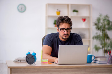 Young male designer working in the office