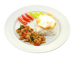 Thai Food Stir-Fried Chicken Spicy and Basil served with Rice ,Fried egg and tomato cucumber carved white plate side view isolated on white background