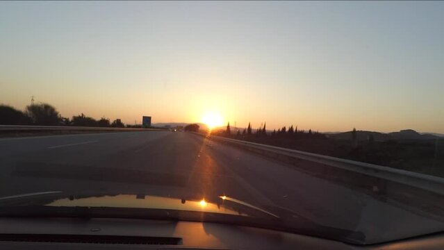 Driving car at sunset through a highway in Turkey. Car dashboard POV view. Travel concept. View from inside a car.