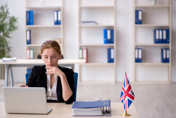 Young female employee working in the office