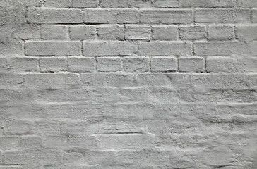 Grey wall, texture, background. The building wall, painted with whiting. Wavy and bumpy surface....