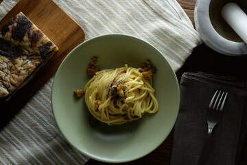 traditional italian dish,  spaghetti carbonara with bacon, egg, aged parmesan
