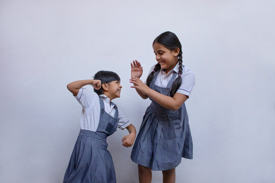 Indian school girls fighting playful
