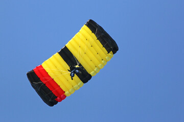 Tandem Skydiver flying wing in a blue sky