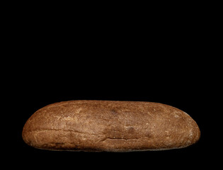 loaf of rye bread on a black background