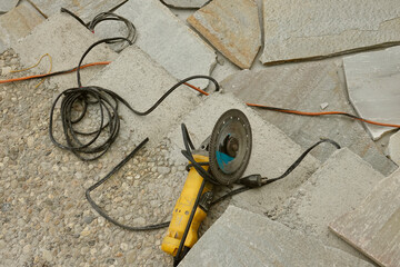 patio installation using power tools and flagstone