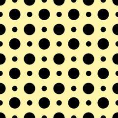 Big and small black circle on yellow background