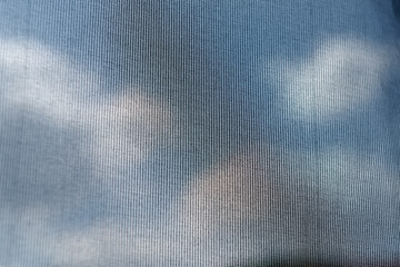 Flowing background: shades of blue and clouds through blue curtain