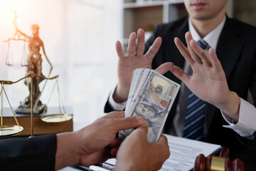 Lawyer refuses to accept bribe from business people in contracting. Corruption and anti bribery concept.