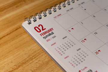 Feb month 2022 Calendar page on wooden background
