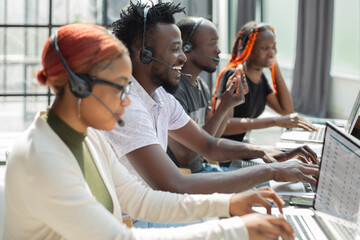 Group of african people working on laptops in a call centre