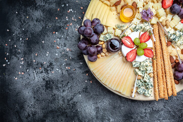 Antipasto platter, Antipasto Cheese board of various types of soft and hard cheese. spanish...