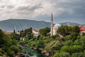 Obraz premium View on Nerteva River and Old City of Mostar with Ottoman Mosque; Mostar in Bosnia and Herzegovina. 